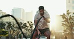 Man, battle rope exercise and outdoor training for muscle workout, energy and fitness intensity. Strong athlete, bodybuilder and swing heavy ropes in city for power, endurance and strength challenge 