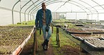 Smile, greenhouse and face of a black man for farming, agriculture or sustainability in nature. Happy, portrait and an African farmer on a field for eco friendly or carbon capture environment