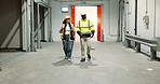 Construction, walking and people in building for planning, maintenance and storage warehouse development. Engineering, teamwork and workers in discussion for manufacturing, architecture or inspection