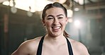 Laughing, fitness and face of happy woman at a gym for training, exercise and athletics routine. Smile, portrait and female personal trainer at sports studio for workout, progress and body challenge