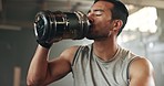 Tired asian man, fitness and drinking water after exercise, workout or training at indoor gym. Active and thirsty male person with mineral liquid for natural nutrition, sports diet or sustainability