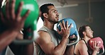 Gym, group fitness and kettlebell squat exercise for power, sports challenge and muscle. Serious asian man, bodybuilder and heavy weights for training in health club, workout class and strong friends
