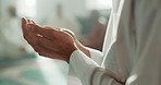 Muslim, praying and hands in a Mosque for spiritual religion or eid mubarak and worship Allah in Ramadan. Islamic, Arabic and holy person with peace or respect for gratitude, trust and hope in temple