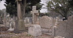 Funeral, empty graveyard and tombstones for death ceremony, religion or memorial service. Catholic symbol, background or Christian sign on gravestone for mourning, burial or loss in public cemetery