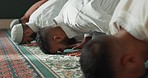 Islamic, praying and men in a Mosque for spiritual religion together as a group to worship Allah in Ramadan. Muslim, Arabic and holy people with peace or respect for gratitude, trust and hope