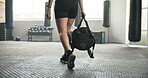 Gym, walking and legs of a woman with a bag to start exercise, sports training or workout for wellness. Feet of an athlete person arrival at health club for fitness, strong muscle and commitment