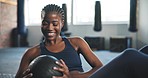 Fitness, gym and black woman on floor with medicine ball for core training, exercise and workout. Sports, Russian twists and happy person for equipment for wellness, performance and muscle strength