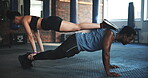 Exercise, push up and a strong couple in the gym together to workout for health, wellness or muscles. Fitness, power or upper body training with a man and woman on the floor for a coaching challenge