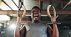 Gym, intense gymnastics and black man doing pull up exercise, arm muscle building or bodybuilding for strength training. Determined, athlete and African person doing fitness, challenge or workout