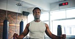 Black man, fitness and skipping rope in cardio workout, exercise or training at indoor gym. Active African male person or athlete jumping ropes in sports motivation, building strength or endurance