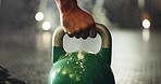 Fitness, training and closeup of hand on kettlebell for weightlifting exercise in a gym. Strength, health and zoom of sports athlete body builder with weight equipment for muscle workout or exercise.