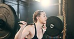 Woman at gym, weight lifting and barbell for muscle building endurance, strong body and balance power in fitness. Commitment, motivation and bodybuilder in workout challenge for health and wellness.