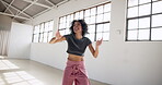 Dance, art and energy with a woman in a studio for fitness, wellness or training for performance. Music, creative and workout with a professional young dancer in an artistic workshop for exercise