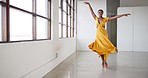 Dancing, ballet and a woman for performance in a creative art studio with energy and passion. African contemporary dancer practice for theater, ballerina and freedom with balance, dress and talent