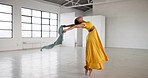 Dance, dress and a woman for performance in a creative art studio with energy and passion. African contemporary dancer practice for theater, sports and freedom with balance, textile and talent