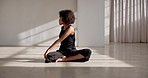 Dancer, stretching back and training exercise for shoulder, body or relax sitting on floor in yoga pose for warm up and mindfulness. Stretch, movement and woman start fitness, workout or practice