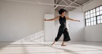 Dance performance, fitness and a woman in a creative art studio with energy and passion. African contemporary dancer practice for theater, sports and freedom with balance, exercise and talent