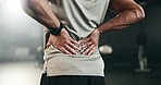 Fitness, back pain and hands of man at gym for training with muscle, problem or arthritis. Sports, injury and guy athlete with joint massage for backache, fibromyalgia or osteoporosis accident