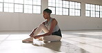 Ballet, black woman and dancer tie shoes ribbon on floor for performance or practice in dance studio or creative school. Student, artist and person in art academy prepare for training or workout  