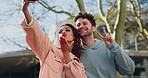 Selfie, peace sign and kiss with a couple on campus posing for a picture together as a college or university memory. Education, funny photography and woman student with her boyfriend outdoor to study