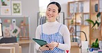 Ecommerce, smile and Asian woman with tablet for sales, checklist and work at fashion startup. Online shopping, boxes and small business owner with happy face, confidence and digital app for web shop