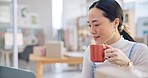 Ecommerce, Asian woman at laptop with coffee and boxes, checking sales email or work at fashion startup. Online shopping, distribution and small business owner with drink, computer and review at desk