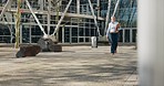 City, walking and business woman by building for travel, morning commute and journey in urban town. Architecture, corporate worker and mature person on trip for corporate career, job and development