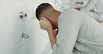 Muslim, religion and man ear washing for prayer in bathroom for purity, and cleaning ritual. Islamic, worship and faith of group of people with wudu together at a mosque or temple for holy practice