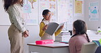 School book, child and reading in class for learning, development and communication. A smart girl kid or student and woman teacher for language story, support and confidence in elementary classroom