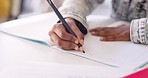 Hands, kid and writing in book, classroom and learning with development, language or paper at desk. Child, scholarship and education with notebook, pen and studying at academy, school or kindergarten