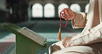 Islam, prayer beads and man in mosque with Quran, mindfulness and gratitude in faith. Worship, religion and Muslim scholar in holy temple for praise with book, spiritual teaching and peace meditation