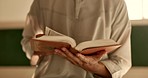 Hands, man in mosque reading Quran and Islamic study of mindfulness, gratitude and faith. Worship, religion and peace, student in holy temple for praise with book and spiritual teaching in meditation