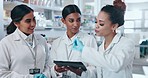 People, scientist and tablet in meeting, research or team discovery together at the laboratory. Group of woman, medical or healthcare professional in teamwork on technology or results in science lab