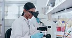 Microscope, science and woman in laboratory of research, analysis and studying genes, particles or dna. Happy young scientist, biotechnology and check lens to review investigation, test or assessment