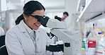 Microscope, science and woman in medical laboratory for dna analysis, genes or chemistry in busy research center. Happy scientist, biotechnology and lens for investigation, test results or healthcare