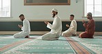 Muslim, religion and people praying in mosque for community, ritual and learning Quran. Holy temple, prayer and men in religious building for Ramadan Kareem, Eid Mubarak and worship Allah on carpet