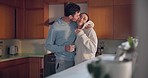 Kiss, love or happy couple in kitchen for romance, care or bonding together in an intimate connection. Relax, coffee drink or people hug in celebration of marriage anniversary in the morning at home