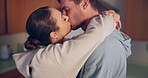 Couple, kiss and hug in kitchen, romance and intimate love with care, bonding and happy for connection. Young man, woman and together with embrace, marriage or anniversary with profile, date and home