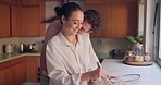 Kiss, love or happy couple baking in kitchen for romance, care or bonding together with an intimate connection. Man, woman and romantic people hug in the morning at home cooking breakfast with smile