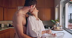 Cooking, love or couple kiss in kitchen for romance, care or bonding together in an intimate connection. Man, woman and romantic people hug in the morning at home to bake or eat breakfast on holiday