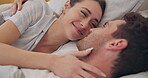 Face, love and smile with a couple in bed together to relax in the morning of a weekend for romance. Happy, cute and a woman with her husband in the bedroom of a home closeup for relationship bonding