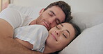 Couple, morning and bed to cuddle with love and hug for comfort, relax and wake up with a smile. A happy man and woman together in a home bedroom for health marriage, rest and good sleep for wellness