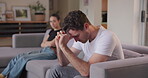 Couple, stress and depression of divorce on sofa for breakup, bad argument and emotional anxiety at home. Sad man, fight and ignore partner in crisis, anger and drama of cheating, worry and jealousy