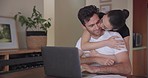 Remote work, love and couple hug, kiss and bond while working on a laptop in their home together. Freelance, telework and man with woman embrace, care and share moment of care, trust or support