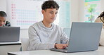 Man, student and laptop for school, elearning and studying or research in college or class. Teenager typing on computer for planning, classroom information and scholarship application or online FAQ