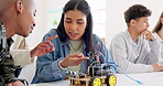 Technology, car robotics and students in classroom, education or learning electronics with car toys for innovation. School kids, learners and transportation knowledge in science class for research