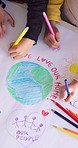 Group of kids in classroom, drawing and art from above for earth day, eco friendly education and kindergarten. Creative poster project together, school children saving the planet and environment.