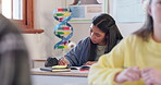 Student, girl and writing notes in high school, learning and study in classroom. Teenager, notebook and kid focus at desk on education, knowledge exercise and reading development in lesson at class