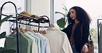 Fashion, shopping and choice with woman in store for boutique, sale and retail. Product, clothes and search with customer and clothing rack option in mall for decision, shirt and inspiration