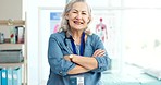 Smile, crossed and face of senior doctor with confidence in her medical consultation office at a clinic. Happy, professional and portrait of elderly woman healthcare worker in a medicare hospital.